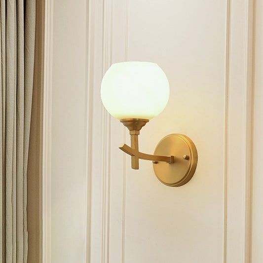 Modern Armed Sconce Light Metal 1 Head Wall Mount Lamp in Brass with Ball Opal Glass Shade Brass Clearhalo 'Cast Iron' 'Glass' 'Industrial' 'Modern wall lights' 'Modern' 'Tiffany' 'Traditional wall lights' 'Wall Lamps & Sconces' 'Wall Lights' Lighting' 325890