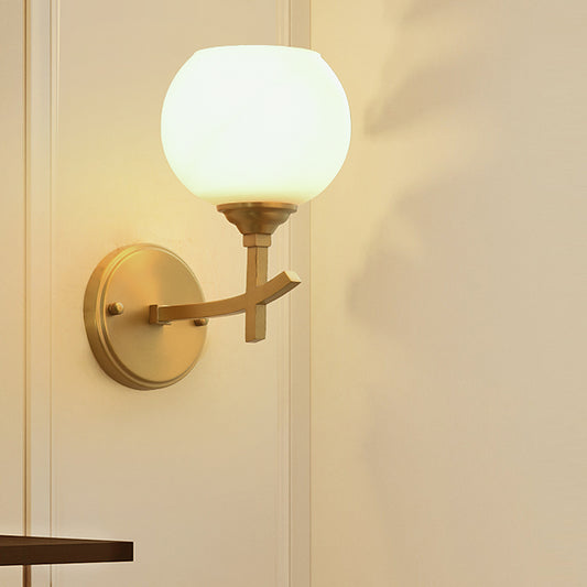 Modern Armed Sconce Light Metal 1 Head Wall Mount Lamp in Brass with Ball Opal Glass Shade Clearhalo 'Cast Iron' 'Glass' 'Industrial' 'Modern wall lights' 'Modern' 'Tiffany' 'Traditional wall lights' 'Wall Lamps & Sconces' 'Wall Lights' Lighting' 325891