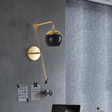 Ball Wall Lighting Modern Clear/Black Glass 1 Bulb Bedside Sconce Light Fixture with Metal Arm Black Clearhalo 'Cast Iron' 'Glass' 'Industrial' 'Modern wall lights' 'Modern' 'Tiffany' 'Traditional wall lights' 'Wall Lamps & Sconces' 'Wall Lights' Lighting' 326075