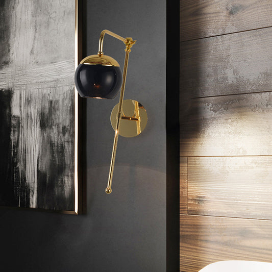 Ball Wall Lighting Modern Clear/Black Glass 1 Bulb Bedside Sconce Light Fixture with Metal Arm Clearhalo 'Cast Iron' 'Glass' 'Industrial' 'Modern wall lights' 'Modern' 'Tiffany' 'Traditional wall lights' 'Wall Lamps & Sconces' 'Wall Lights' Lighting' 326076