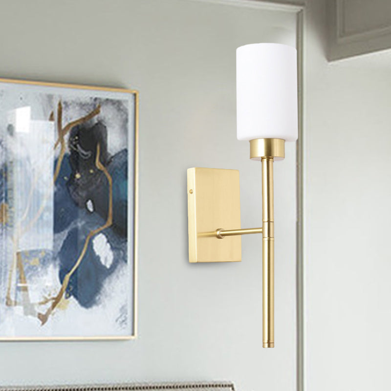 Opal Glass Tube Sconce Modernist 1 Bulb Wall Lighting Fixture in Brass with Metal Pencil Arm Clearhalo 'Cast Iron' 'Glass' 'Industrial' 'Modern wall lights' 'Modern' 'Tiffany' 'Traditional wall lights' 'Wall Lamps & Sconces' 'Wall Lights' Lighting' 330828