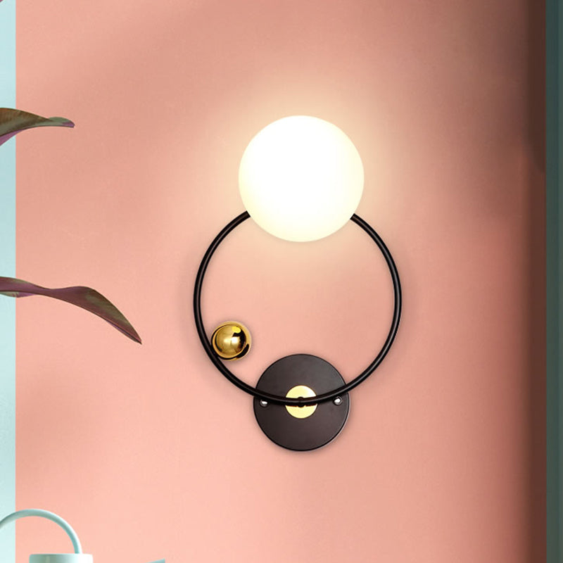 Black Circular Wall Lighting Modernist 1 Head Metal Sconce Light Fixture with Opal Glass Shade Clearhalo 'Cast Iron' 'Glass' 'Industrial' 'Modern wall lights' 'Modern' 'Tiffany' 'Traditional wall lights' 'Wall Lamps & Sconces' 'Wall Lights' Lighting' 330838