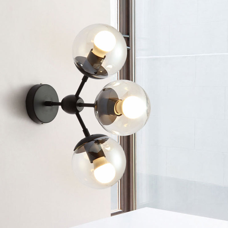 3 Bulbs Spherical Vanity Light Modern Clear Glass Wall Mounted Lighting in Black for Bathroom Clearhalo 'Cast Iron' 'Glass' 'Industrial' 'Modern wall lights' 'Modern' 'Tiffany' 'Traditional wall lights' 'Wall Lamps & Sconces' 'Wall Lights' Lighting' 330880