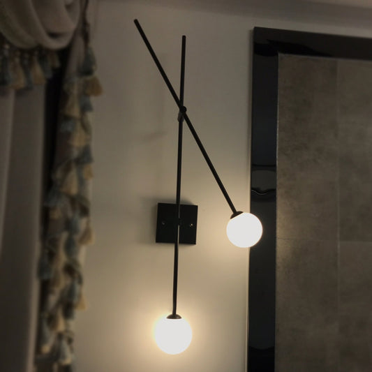 Opal Glass Bubble Wall Lighting Minimalist 2 Bulbs Sconce Light Fixture in Black/Gold with Metal Arm Black Clearhalo 'Cast Iron' 'Glass' 'Industrial' 'Modern wall lights' 'Modern' 'Tiffany' 'Traditional wall lights' 'Wall Lamps & Sconces' 'Wall Lights' Lighting' 331408
