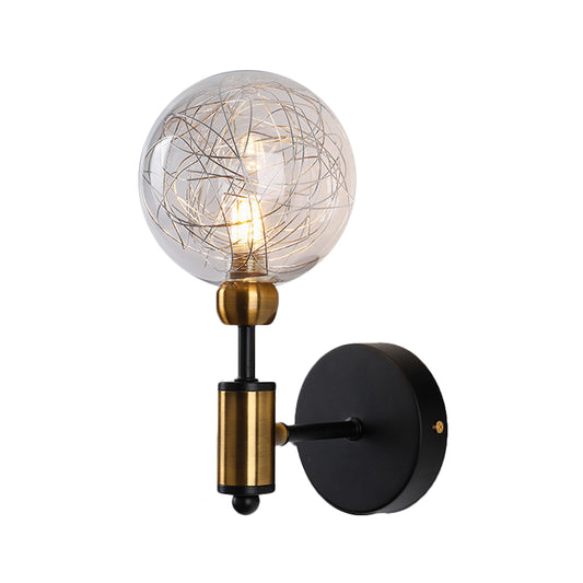 1/2-Light Bedroom Sconce Wall Light Industrial Style Black/Brass Finish Wall Lamp with Orbit Clear Glass Shade Clearhalo 'Art deco wall lights' 'Cast Iron' 'Glass' 'Industrial wall lights' 'Industrial' 'Middle century wall lights' 'Modern' 'Rustic wall lights' 'Tiffany' 'Traditional wall lights' 'Wall Lamps & Sconces' 'Wall Lights' Lighting' 331673
