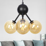 Amber Glass Globe Ceiling Chandelier Modernist 3 Heads LED Hanging Pendant Lamp in Black Clearhalo 'Ceiling Lights' 'Chandeliers' 'Glass shade' 'Glass' 'Modern Chandeliers' 'Modern' 'Pendant Lights' Lighting' 331845