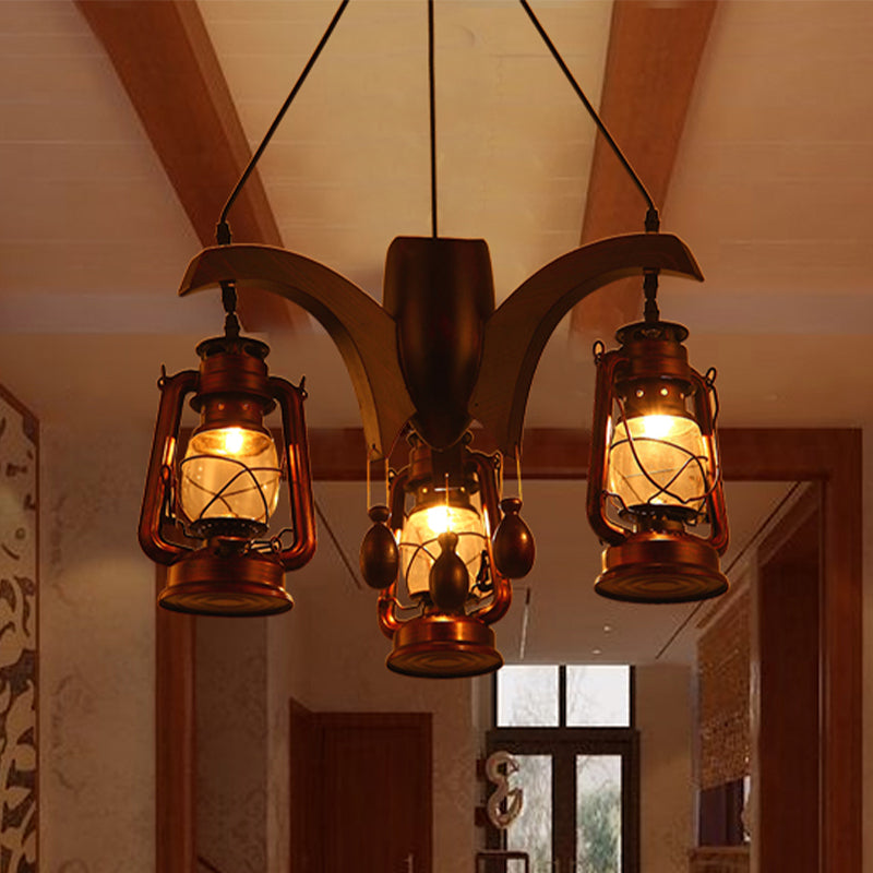 Industrial Kerosene Chandelier Lamp 3 Lights Clear Glass Hanging Ceiling Light in Dark Wood for Living Room Clearhalo 'Ceiling Lights' 'Chandeliers' 'Glass shade' 'Glass' 'Industrial Chandeliers' 'Industrial' 'Middle Century Chandeliers' 'Tiffany' Lighting' 337405