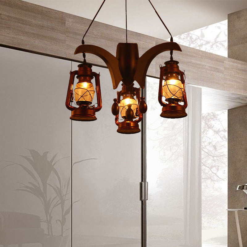 Industrial Kerosene Chandelier Lamp 3 Lights Clear Glass Hanging Ceiling Light in Dark Wood for Living Room Clearhalo 'Ceiling Lights' 'Chandeliers' 'Glass shade' 'Glass' 'Industrial Chandeliers' 'Industrial' 'Middle Century Chandeliers' 'Tiffany' Lighting' 337406