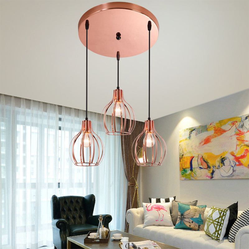 Metallic Rose Gold Pendant Lighting Global Cage Shade 3 Lights Industrial Style Ceiling Light Fixture with Round/Linear Canopy Rose Gold Round Clearhalo 'Ceiling Lights' 'Modern Pendants' 'Modern' 'Pendant Lights' 'Pendants' Lighting' 34791