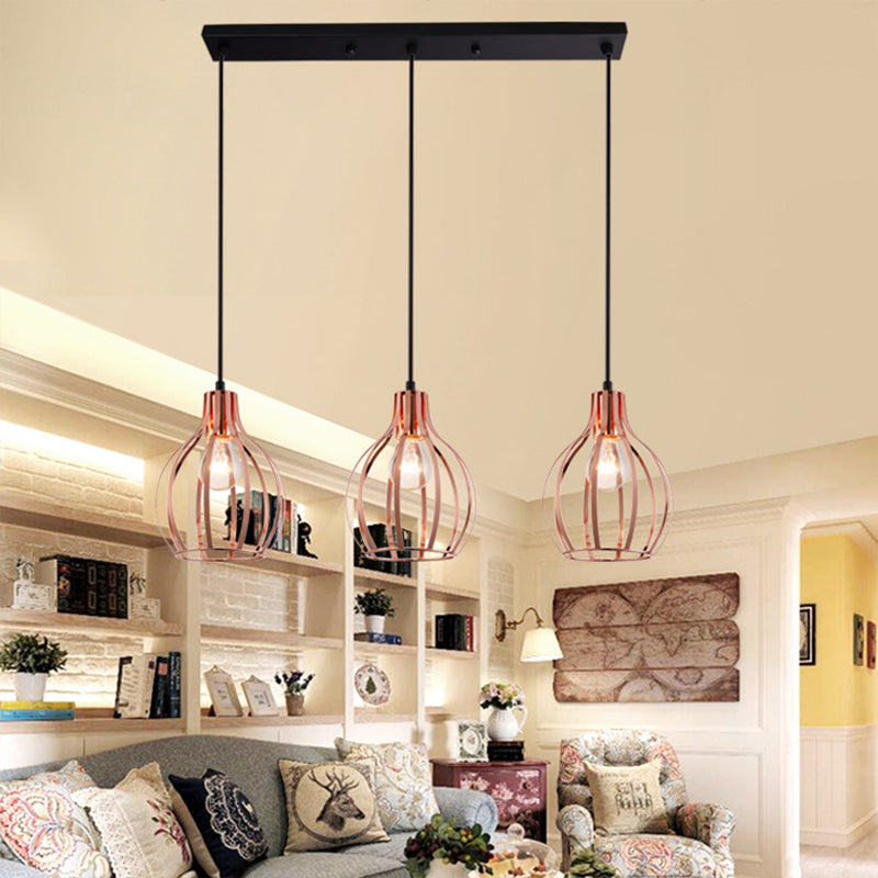 Metallic Rose Gold Pendant Lighting Global Cage Shade 3 Lights Industrial Style Ceiling Light Fixture with Round/Linear Canopy Clearhalo 'Ceiling Lights' 'Modern Pendants' 'Modern' 'Pendant Lights' 'Pendants' Lighting' 34797