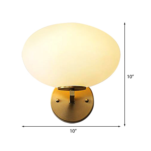 Milk Glass Oval Wall Mount Lamp Modern 1 Light Bedside Wall Sconce Light in Brass Clearhalo 'Cast Iron' 'Glass' 'Industrial' 'Modern wall lights' 'Modern' 'Tiffany' 'Traditional wall lights' 'Vanity Lights' 'Wall Lights' Lighting' 370187