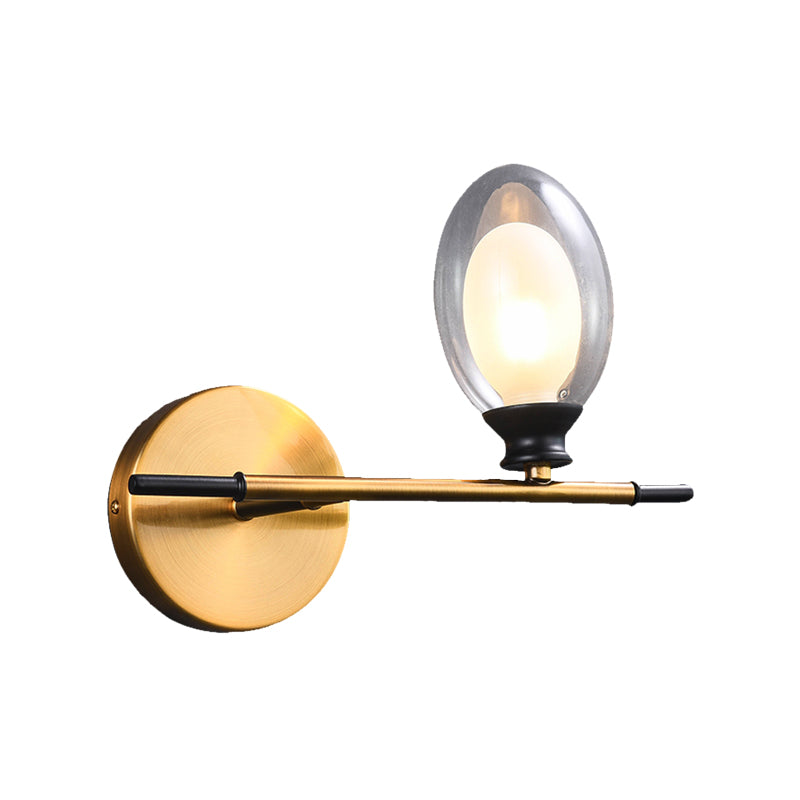 Vintage Oval Wall Sconce 1 Light Clear Glass Bedroom Wall Mounted Lamp with Brass Bar Clearhalo 'Cast Iron' 'Glass' 'Industrial' 'Modern wall lights' 'Modern' 'Tiffany' 'Traditional wall lights' 'Vanity Lights' 'Wall Lights' Lighting' 370365