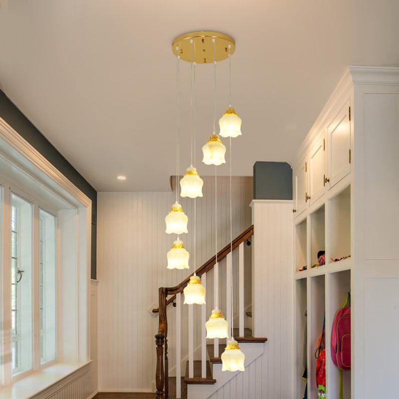 White Glass Floral Cluster Pendant Light Modernism 8 Lights Stair Hanging Lamp in Gold Clearhalo 'Ceiling Lights' 'Glass shade' 'Glass' 'Modern Pendants' 'Modern' 'Pendant Lights' 'Pendants' Lighting' 393530