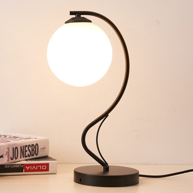 White Glass Ball Task Lamp Modernist 1 Head Black Reading Book Light with Curved Metal Arm Clearhalo 'Lamps' 'Table Lamps' Lighting' 400327