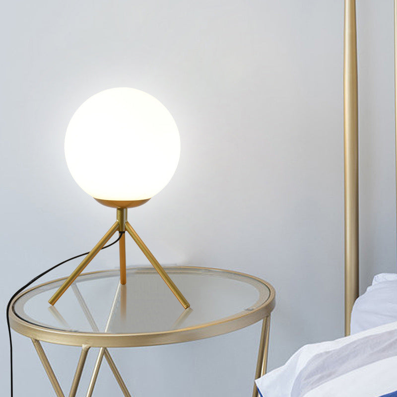 Opal Glass Sphere Desk Light Modern 1 Bulb Night Table Lamp in Gold/Black with Metal Tripod Clearhalo 'Lamps' 'Table Lamps' Lighting' 402346