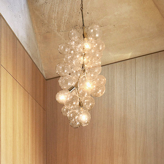 Modern Ball Hanging Ceiling Lamp Clear Glass 3/5-Light Living Room Chandelier Pendant in Gold Clearhalo 'Ceiling Lights' 'Chandeliers' 'Glass shade' 'Glass' 'Modern Chandeliers' 'Modern' Lighting' 415854