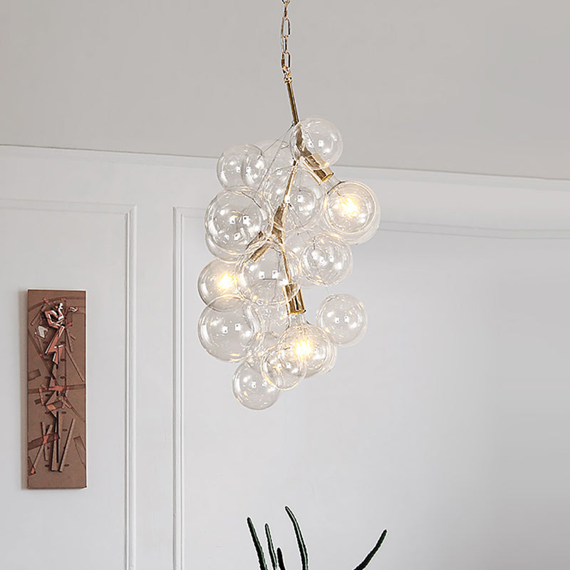 Modern Ball Hanging Ceiling Lamp Clear Glass 3/5-Light Living Room Chandelier Pendant in Gold Clearhalo 'Ceiling Lights' 'Chandeliers' 'Glass shade' 'Glass' 'Modern Chandeliers' 'Modern' Lighting' 415855