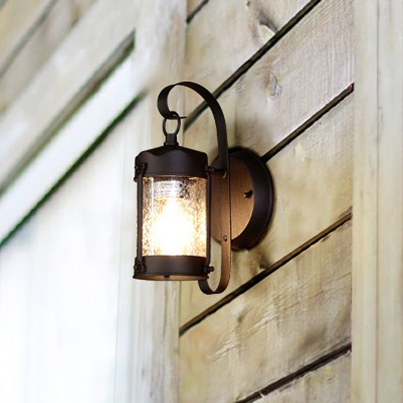 Cylinder/Lantern Seeded Glass Wall Hanging Light Traditional Single Bulb Outdoor Sconce Lamp in Clear Clearhalo 'Art deco wall lights' 'Cast Iron' 'Glass' 'Industrial wall lights' 'Industrial' 'Middle century wall lights' 'Modern' 'Rustic wall lights' 'Tiffany' 'Traditional wall lights' 'Wall Lamps & Sconces' 'Wall Lights' Lighting' 467187
