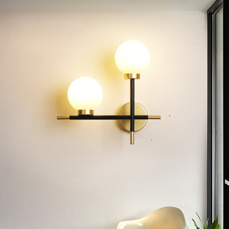 2-Bulb Milky Glass Sconce Light Fixture Modern Black Double Globe Living Room Wall Lamp with Cross Design Clearhalo 'Cast Iron' 'Glass' 'Industrial' 'Modern wall lights' 'Modern' 'Tiffany' 'Traditional wall lights' 'Wall Lamps & Sconces' 'Wall Lights' Lighting' 468457