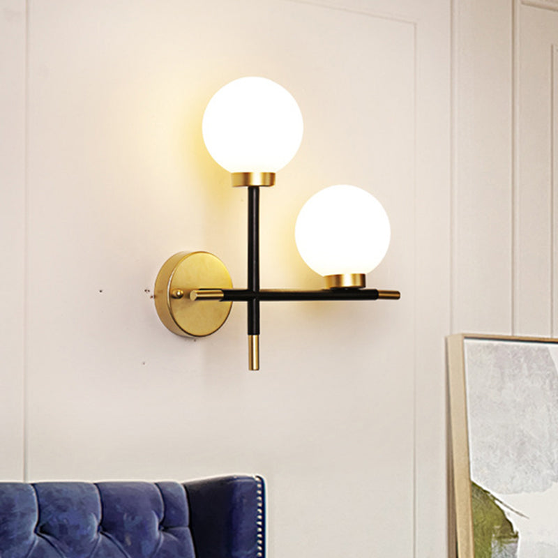 2-Bulb Milky Glass Sconce Light Fixture Modern Black Double Globe Living Room Wall Lamp with Cross Design Clearhalo 'Cast Iron' 'Glass' 'Industrial' 'Modern wall lights' 'Modern' 'Tiffany' 'Traditional wall lights' 'Wall Lamps & Sconces' 'Wall Lights' Lighting' 468458