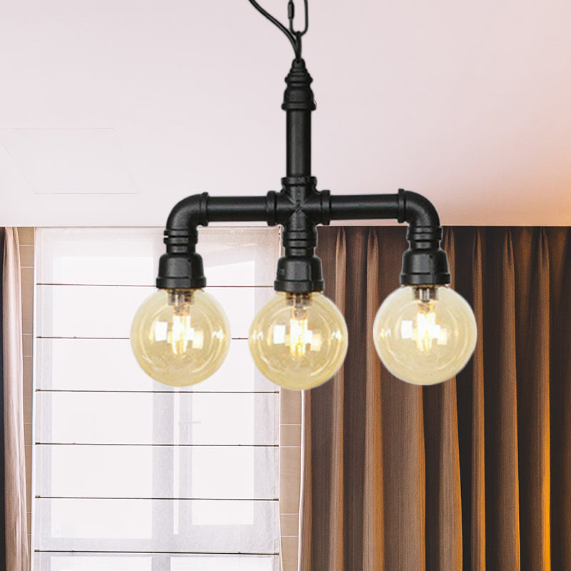 Ball Amber Glass Pendant Light Industrial 3/4 Lights Restaurant LED Ceiling Chandelier in Black with Pipe Arm Clearhalo 'Ceiling Lights' 'Chandeliers' 'Glass shade' 'Glass' 'Industrial Chandeliers' 'Industrial' 'Middle Century Chandeliers' 'Pendant Lights' 'Tiffany' Lighting' 511156