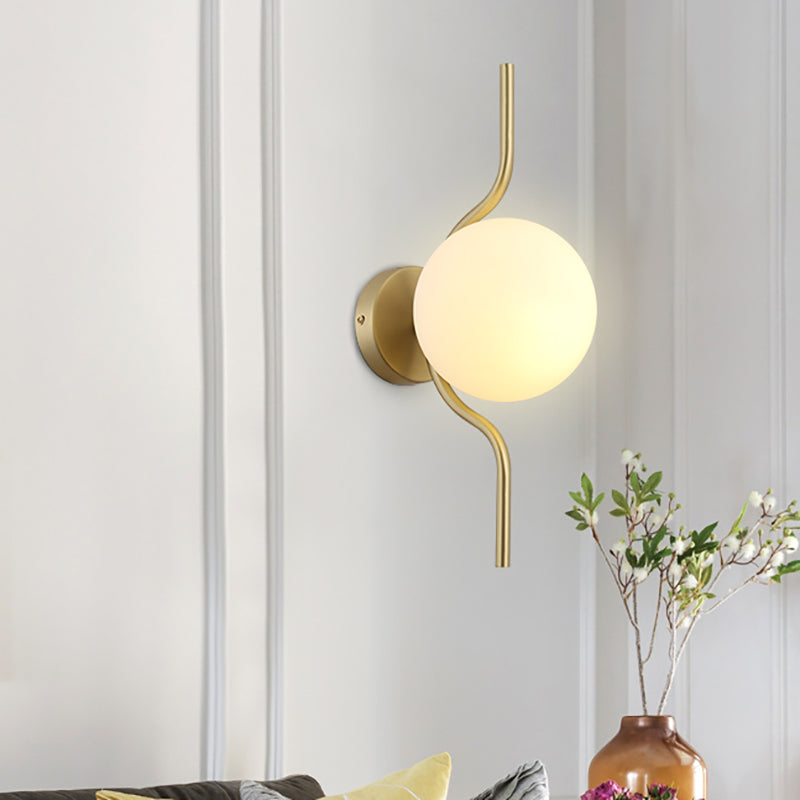 Globe White Glass Wall Mount Light Postmodern 1 Light Sconce Light with Gold Arm and Base Clearhalo 'Cast Iron' 'Glass' 'Industrial' 'Modern wall lights' 'Modern' 'Tiffany' 'Traditional wall lights' 'Wall Lamps & Sconces' 'Wall Lights' Lighting' 512601