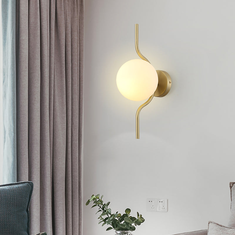 Globe White Glass Wall Mount Light Postmodern 1 Light Sconce Light with Gold Arm and Base Clearhalo 'Cast Iron' 'Glass' 'Industrial' 'Modern wall lights' 'Modern' 'Tiffany' 'Traditional wall lights' 'Wall Lamps & Sconces' 'Wall Lights' Lighting' 512602