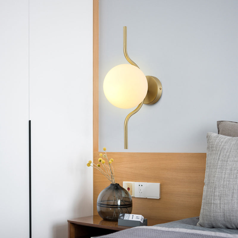 Globe White Glass Wall Mount Light Postmodern 1 Light Sconce Light with Gold Arm and Base Clearhalo 'Cast Iron' 'Glass' 'Industrial' 'Modern wall lights' 'Modern' 'Tiffany' 'Traditional wall lights' 'Wall Lamps & Sconces' 'Wall Lights' Lighting' 512603