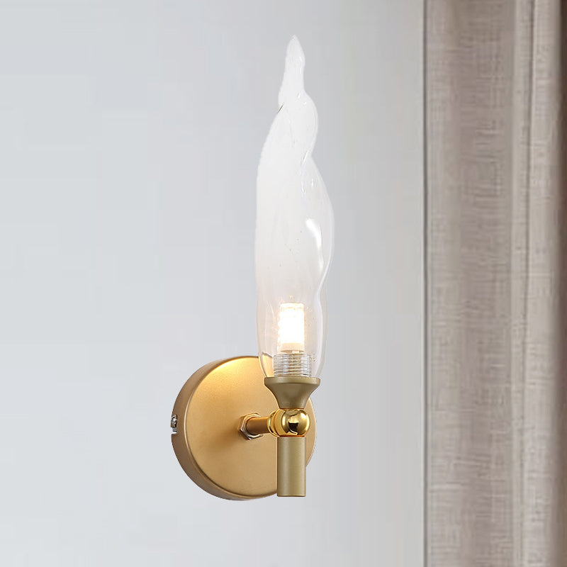 Brass Torch Shape Sconce Lighting Modernist 1 Bulb Clear Glass LED Wall Mount Lamp for Bedside Clearhalo 'Cast Iron' 'Glass' 'Industrial' 'Modern wall lights' 'Modern' 'Tiffany' 'Traditional wall lights' 'Wall Lamps & Sconces' 'Wall Lights' Lighting' 512820