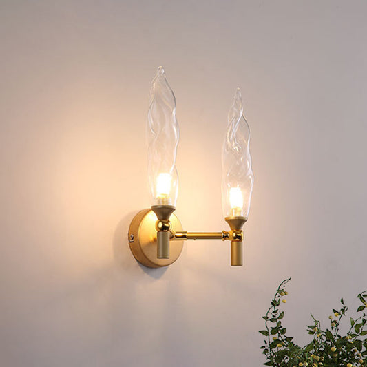 Double Arm Wall Lighting Modernism Metal 2 Bulbs Living Room Wall Mount Sconce in Gold with Torch Clear Glass Shade Gold Clearhalo 'Cast Iron' 'Glass' 'Industrial' 'Modern wall lights' 'Modern' 'Tiffany' 'Traditional wall lights' 'Wall Lamps & Sconces' 'Wall Lights' Lighting' 512883