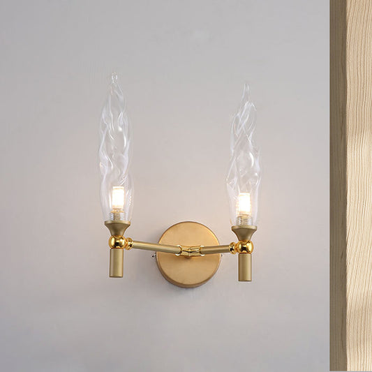 Double Arm Wall Lighting Modernism Metal 2 Bulbs Living Room Wall Mount Sconce in Gold with Torch Clear Glass Shade Clearhalo 'Cast Iron' 'Glass' 'Industrial' 'Modern wall lights' 'Modern' 'Tiffany' 'Traditional wall lights' 'Wall Lamps & Sconces' 'Wall Lights' Lighting' 512884