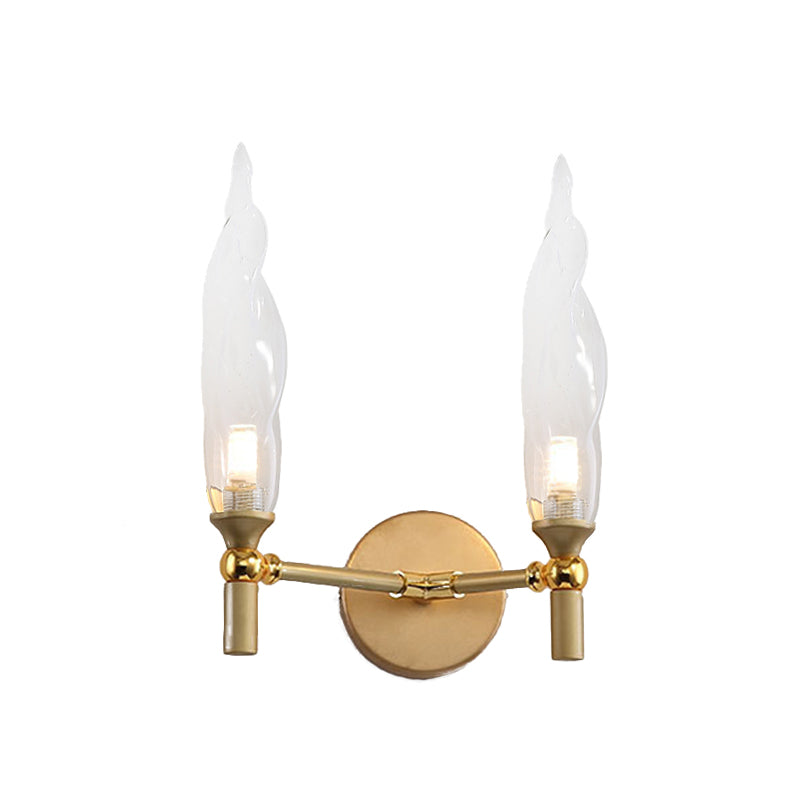 Double Arm Wall Lighting Modernism Metal 2 Bulbs Living Room Wall Mount Sconce in Gold with Torch Clear Glass Shade Clearhalo 'Cast Iron' 'Glass' 'Industrial' 'Modern wall lights' 'Modern' 'Tiffany' 'Traditional wall lights' 'Wall Lamps & Sconces' 'Wall Lights' Lighting' 512886