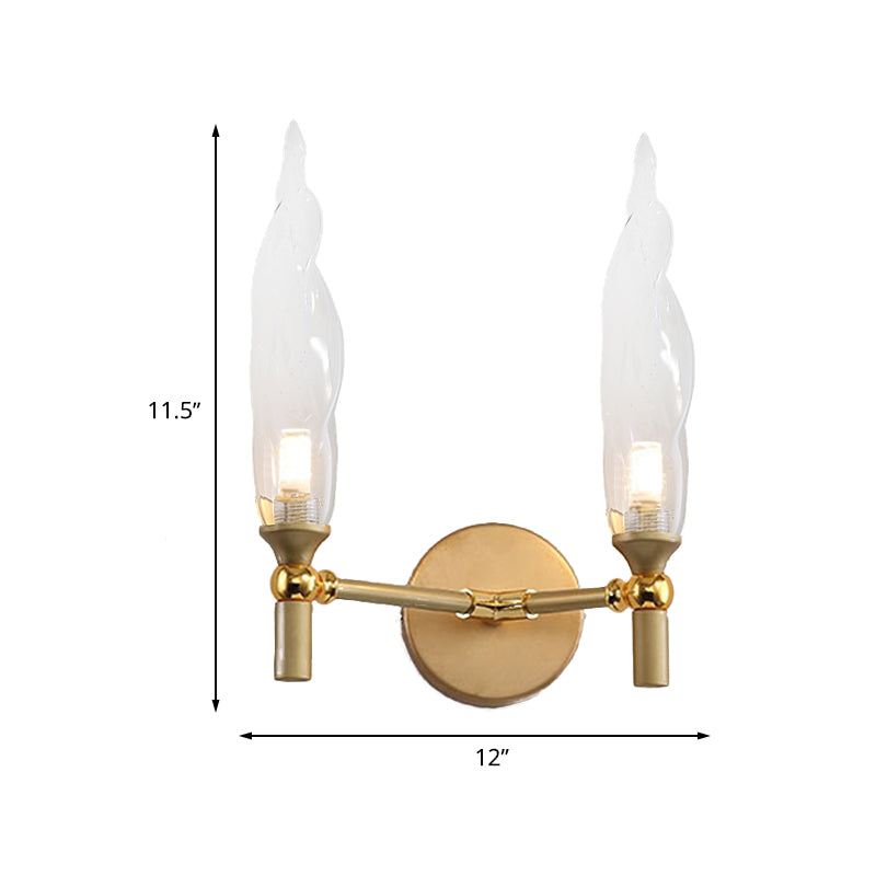 Double Arm Wall Lighting Modernism Metal 2 Bulbs Living Room Wall Mount Sconce in Gold with Torch Clear Glass Shade Clearhalo 'Cast Iron' 'Glass' 'Industrial' 'Modern wall lights' 'Modern' 'Tiffany' 'Traditional wall lights' 'Wall Lamps & Sconces' 'Wall Lights' Lighting' 512887