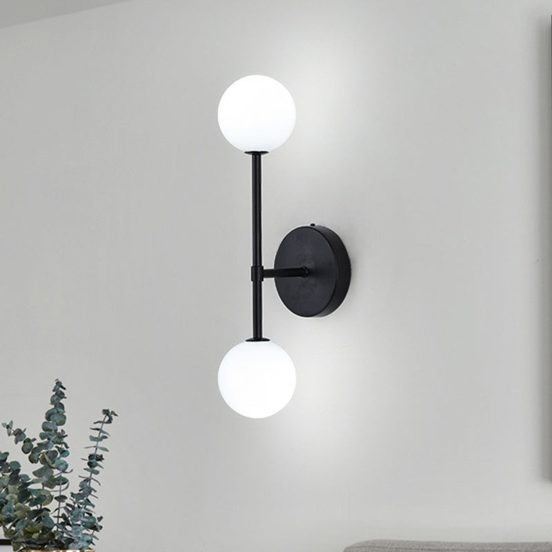 Orb White Glass Sconce Lighting Modernist 2 Bulbs Black/Gold Finish Wall Mounted Lamp Fixture for Living Room Black Clearhalo 'Cast Iron' 'Glass' 'Industrial' 'Modern wall lights' 'Modern' 'Tiffany' 'Traditional wall lights' 'Wall Lamps & Sconces' 'Wall Lights' Lighting' 512941