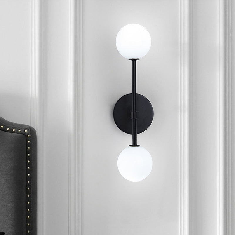 Orb White Glass Sconce Lighting Modernist 2 Bulbs Black/Gold Finish Wall Mounted Lamp Fixture for Living Room Clearhalo 'Cast Iron' 'Glass' 'Industrial' 'Modern wall lights' 'Modern' 'Tiffany' 'Traditional wall lights' 'Wall Lamps & Sconces' 'Wall Lights' Lighting' 512942