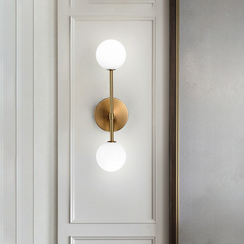 Orb White Glass Sconce Lighting Modernist 2 Bulbs Black/Gold Finish Wall Mounted Lamp Fixture for Living Room Clearhalo 'Cast Iron' 'Glass' 'Industrial' 'Modern wall lights' 'Modern' 'Tiffany' 'Traditional wall lights' 'Wall Lamps & Sconces' 'Wall Lights' Lighting' 512947