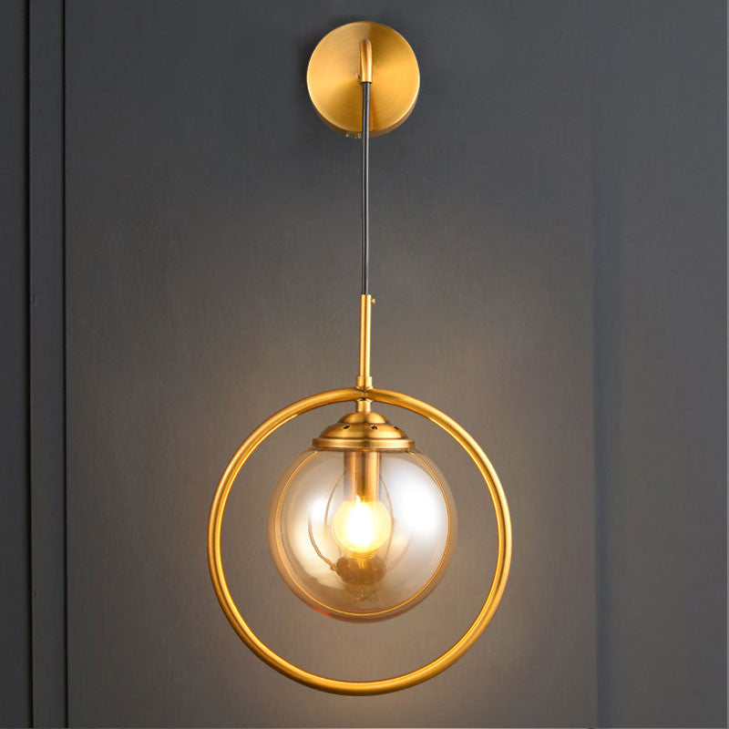 Metal Ring Sconce Lighting Modern 1-Bulb Brass Wall Mounted Lamp with Sphere Tan Glass Shade for Bedside Clearhalo 'Cast Iron' 'Glass' 'Industrial' 'Modern wall lights' 'Modern' 'Tiffany' 'Traditional wall lights' 'Wall Lamps & Sconces' 'Wall Lights' Lighting' 513010