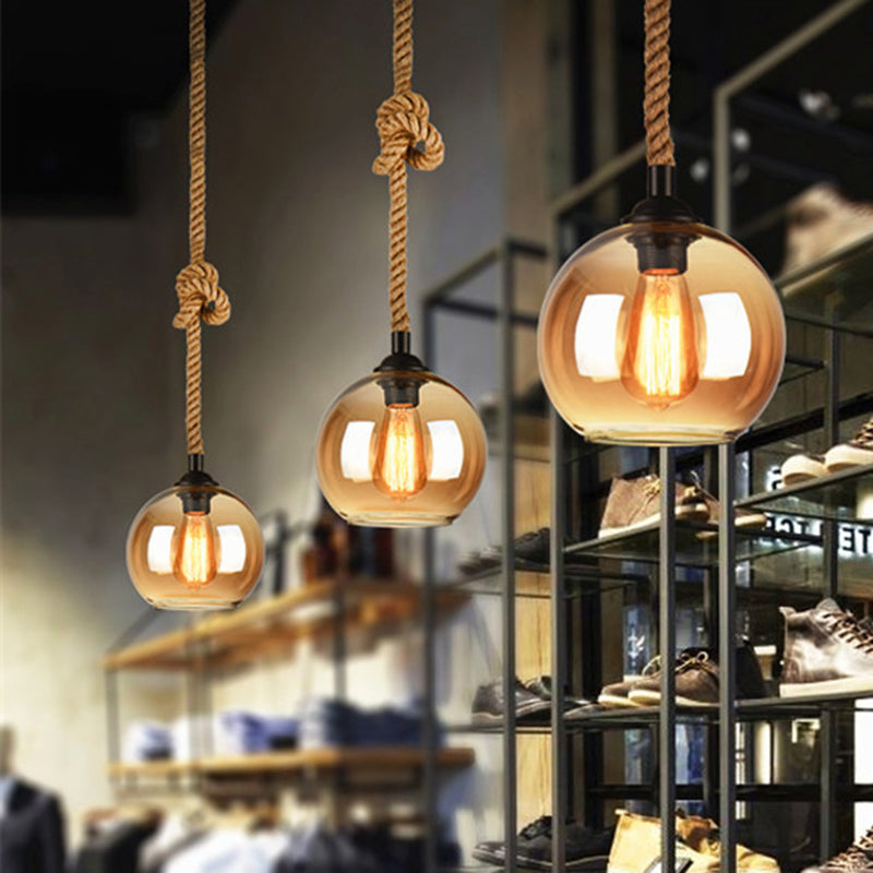 8"/10" Wide Globe Pendant Lighting Industrial 1 Light Clear/Amber Glass Hanging Lamp in Black Clearhalo 'Ceiling Lights' 'Glass shade' 'Glass' 'Modern Pendants' 'Modern' 'Pendant Lights' 'Pendants' Lighting' 513283