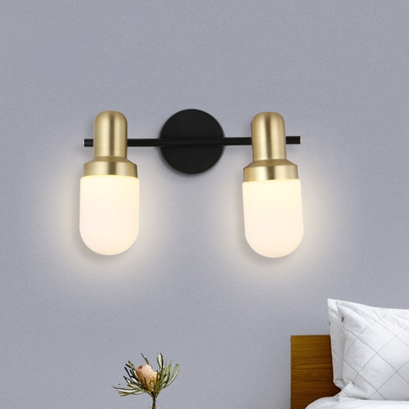 Modern Capsule Glass Sconce Light 1/2/3 Lights Wall Mount Light with Black Arm and Backplate Clearhalo 'Cast Iron' 'Glass' 'Industrial' 'Modern wall lights' 'Modern' 'Tiffany' 'Traditional wall lights' 'Wall Lamps & Sconces' 'Wall Lights' Lighting' 519884