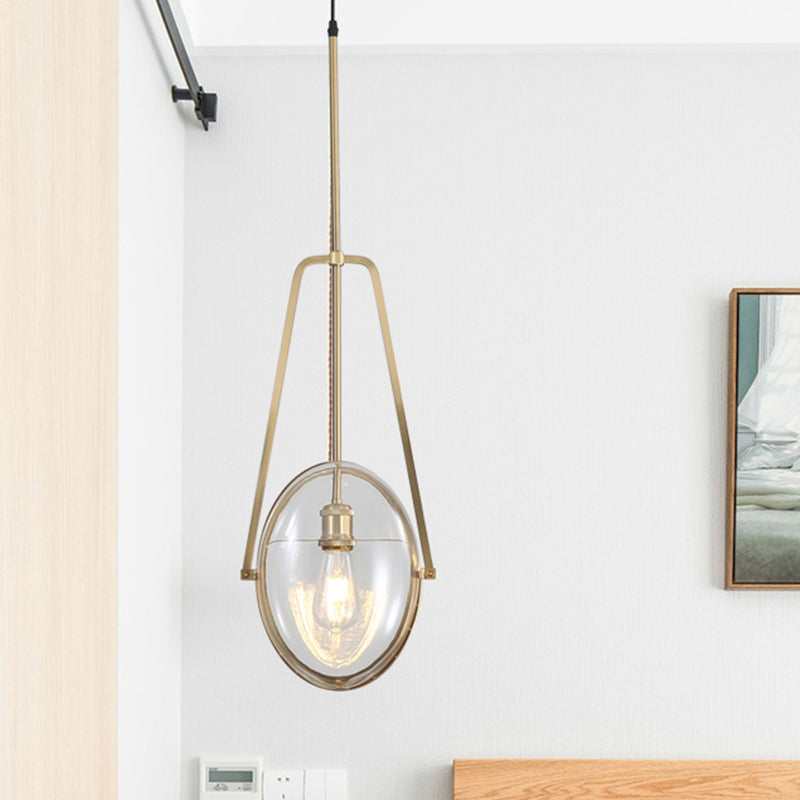 Brass Oval Pendant Light Contemporary 1-Light Clear Glass Ceiling Lamp with Forked Halberd Frame Brass Clearhalo 'Ceiling Lights' 'Glass shade' 'Glass' 'Modern Pendants' 'Modern' 'Pendant Lights' 'Pendants' Lighting' 519918