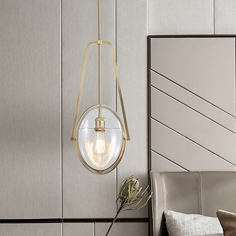 Brass Oval Pendant Light Contemporary 1-Light Clear Glass Ceiling Lamp with Forked Halberd Frame Clearhalo 'Ceiling Lights' 'Glass shade' 'Glass' 'Modern Pendants' 'Modern' 'Pendant Lights' 'Pendants' Lighting' 519919