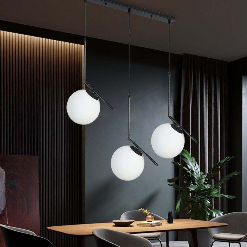 Cream Glass Orb Clster Pendant Light Modernism 3-Light Ceiling Lamp in Black with Angled Arm Black Clearhalo 'Ceiling Lights' 'Glass shade' 'Glass' 'Modern Pendants' 'Modern' 'Pendant Lights' 'Pendants' Lighting' 520132