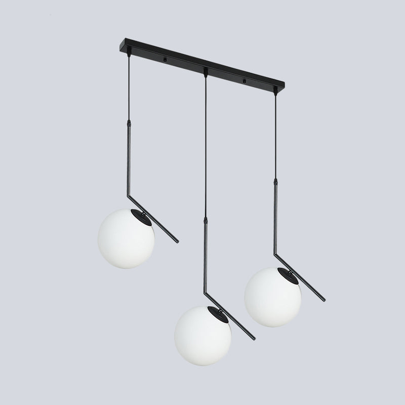 Cream Glass Orb Clster Pendant Light Modernism 3-Light Ceiling Lamp in Black with Angled Arm Clearhalo 'Ceiling Lights' 'Glass shade' 'Glass' 'Modern Pendants' 'Modern' 'Pendant Lights' 'Pendants' Lighting' 520135