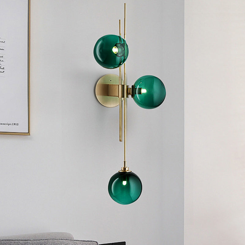 Green/Clear Glass Globe Wall Sconce Lamp Contemporary 3 Lights Wall Light Fixture in Brass Clearhalo 'Cast Iron' 'Glass' 'Industrial' 'Modern wall lights' 'Modern' 'Tiffany' 'Traditional wall lights' 'Wall Lamps & Sconces' 'Wall Lights' Lighting' 520459