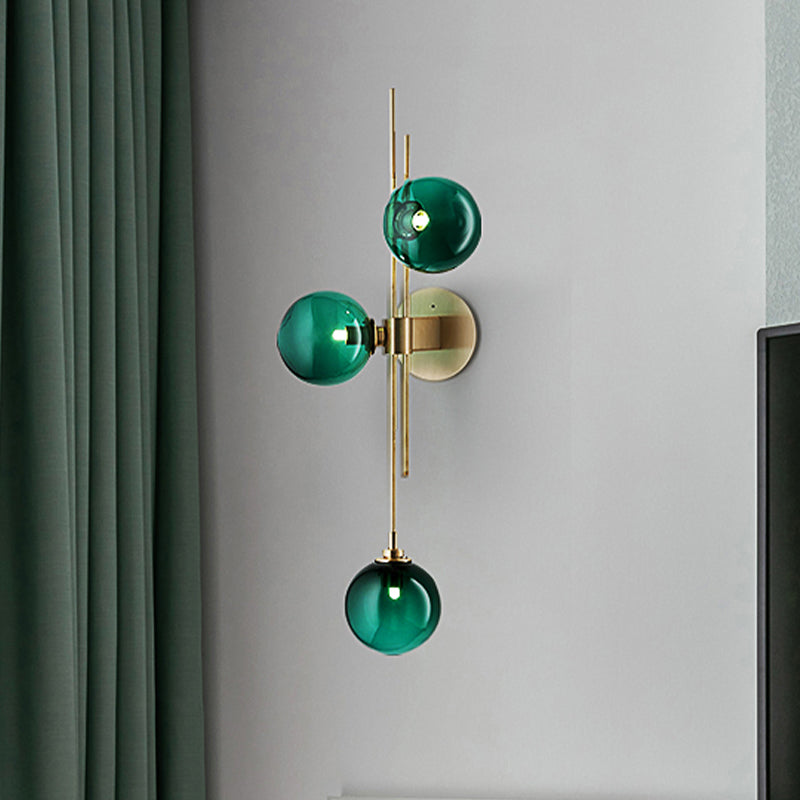 Green/Clear Glass Globe Wall Sconce Lamp Contemporary 3 Lights Wall Light Fixture in Brass Clearhalo 'Cast Iron' 'Glass' 'Industrial' 'Modern wall lights' 'Modern' 'Tiffany' 'Traditional wall lights' 'Wall Lamps & Sconces' 'Wall Lights' Lighting' 520460