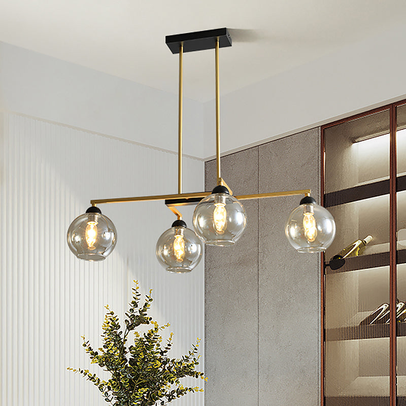 Linear Dining Room Down Lighting Metal 4-Light Simple Chandelier in Brass with Globe Clear Glass Shade Brass Clearhalo 'Ceiling Lights' 'Chandeliers' 'Glass shade' 'Glass' 'Modern Chandeliers' 'Modern' Lighting' 520488