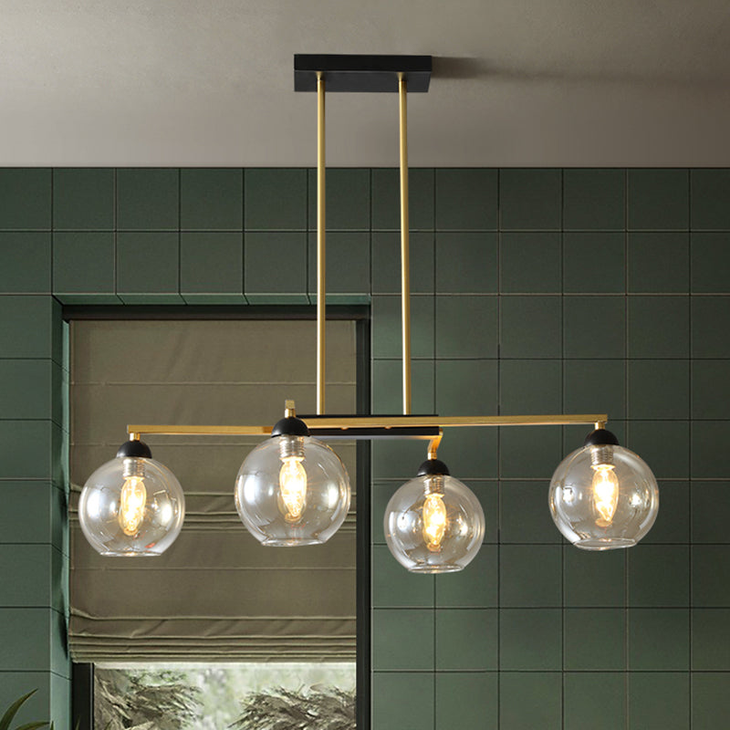 Linear Dining Room Down Lighting Metal 4-Light Simple Chandelier in Brass with Globe Clear Glass Shade Clearhalo 'Ceiling Lights' 'Chandeliers' 'Glass shade' 'Glass' 'Modern Chandeliers' 'Modern' Lighting' 520489