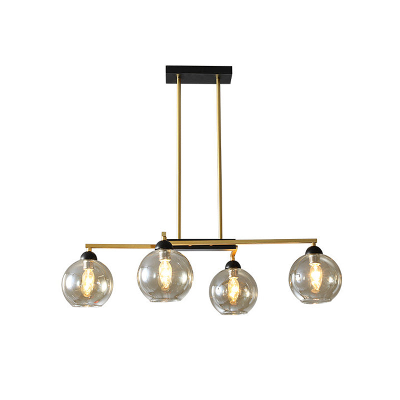 Linear Dining Room Down Lighting Metal 4-Light Simple Chandelier in Brass with Globe Clear Glass Shade Clearhalo 'Ceiling Lights' 'Chandeliers' 'Glass shade' 'Glass' 'Modern Chandeliers' 'Modern' Lighting' 520490