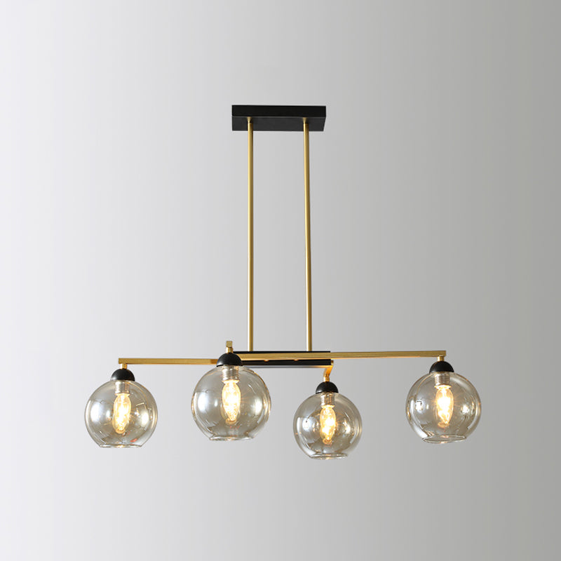 Linear Dining Room Down Lighting Metal 4-Light Simple Chandelier in Brass with Globe Clear Glass Shade Clearhalo 'Ceiling Lights' 'Chandeliers' 'Glass shade' 'Glass' 'Modern Chandeliers' 'Modern' Lighting' 520491