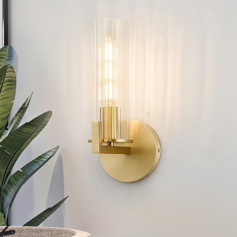 Brass Cylinder Wall Light Sconce Post Modern 1 Head Clear Glass Wall Mount Lamp for Bedside Clearhalo 'Cast Iron' 'Glass' 'Industrial' 'Modern wall lights' 'Modern' 'Tiffany' 'Traditional wall lights' 'Wall Lamps & Sconces' 'Wall Lights' Lighting' 520677